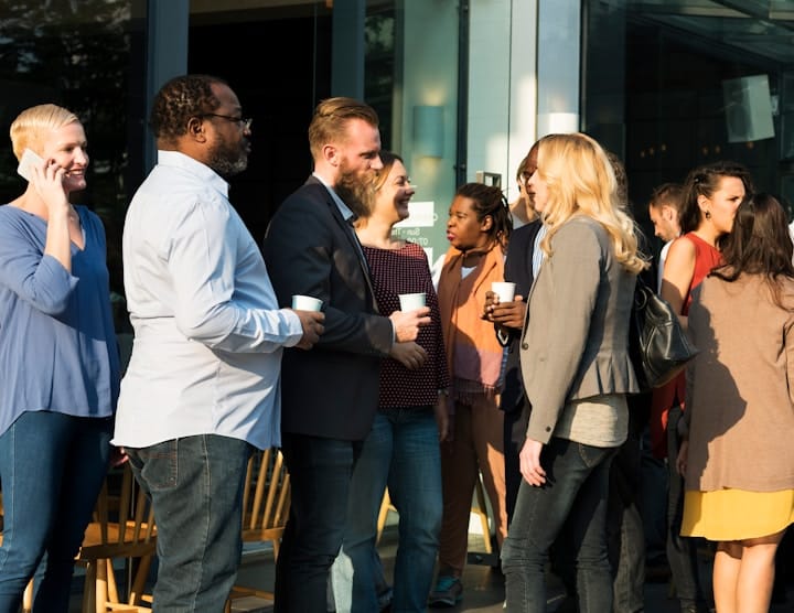 An illustration depicting a first-time entrepreneur engaging with a diverse group of professionals at a networking event