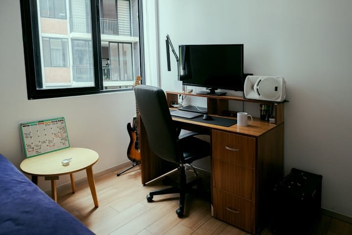 Remote Work Desk Setup Next to a Window