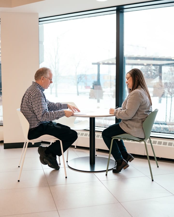 A mentor providing guidance to a startup founder in a meeting