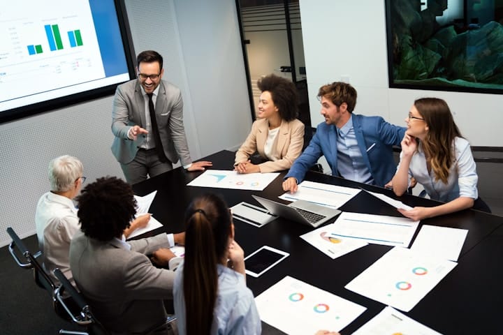 A professional team engaged in a meeting, showcasing diverse leadership dynamics