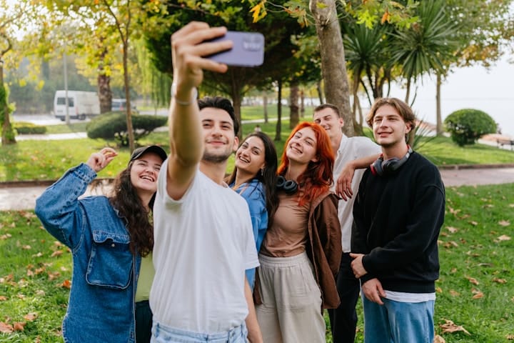 Group of Friends Taking Photos Together