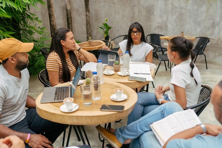 A group of entrepreneurs participating in a group mentorship session