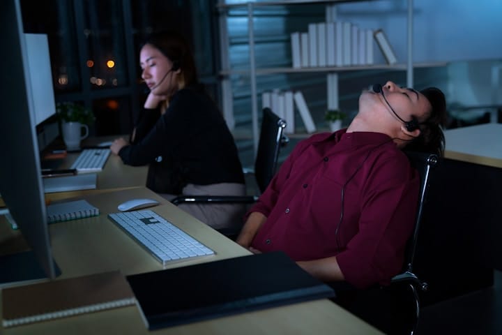 Stock image of a tired entrepreneur working late