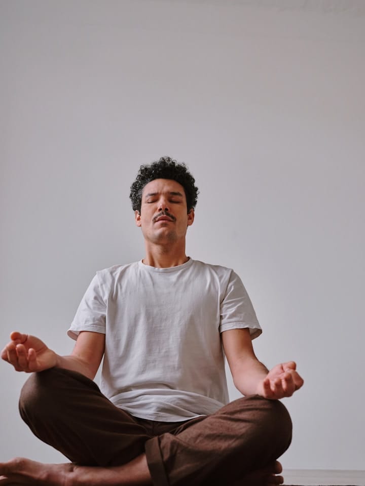 Stock image of a person meditating or practicing mindfulness