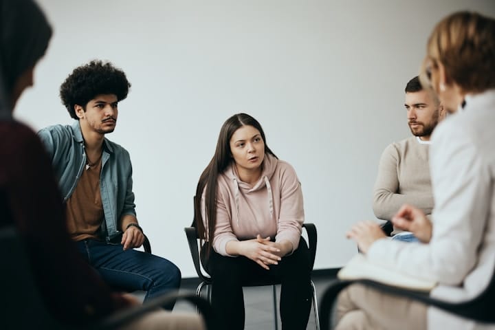 Group of People Engaged in a Discussion