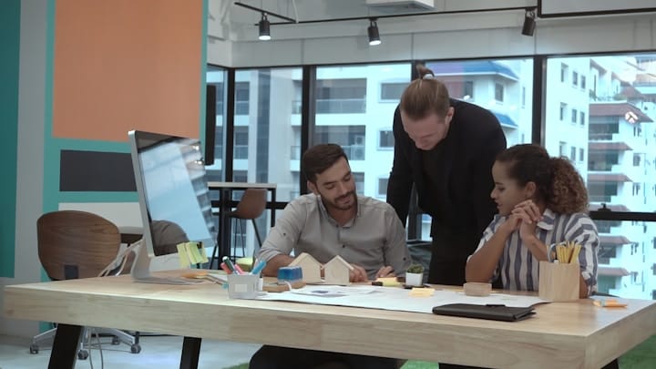 Diverse team collaborating in a modern workspace