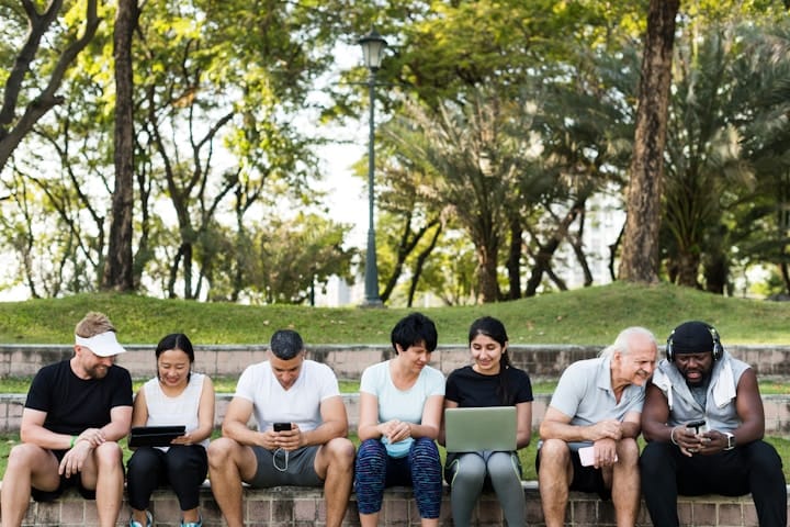 Diverse Group Analyzing Data on Digital Devices