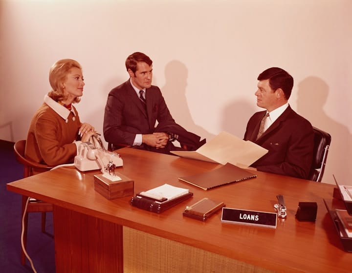 Stock photo of a business meeting with financial documents