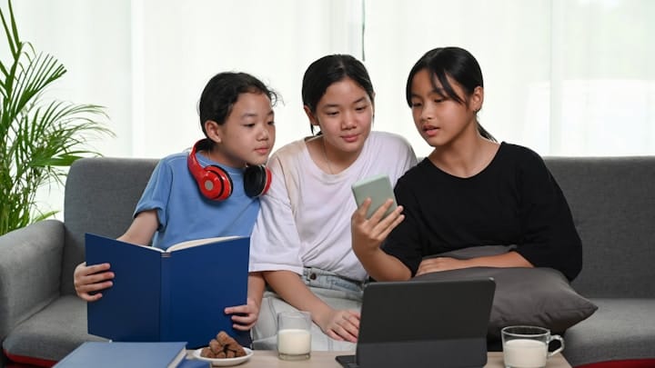 Diverse Group of Young Individuals Using Technology